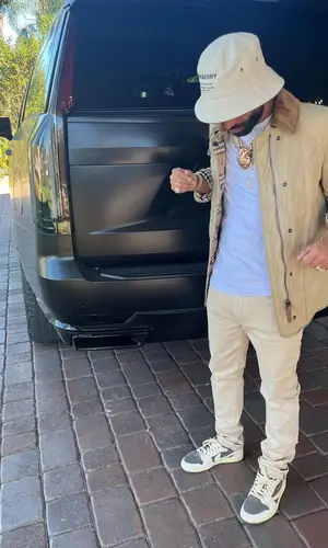 Arcangel wearing Purple Brand jeans