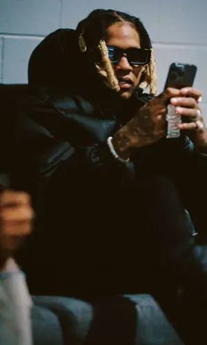 Lil Durk wearing Prada boots