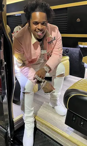 Finesse2tymes wearing Amiri jeans