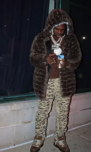 EST Gee wearing Givenchy jeans