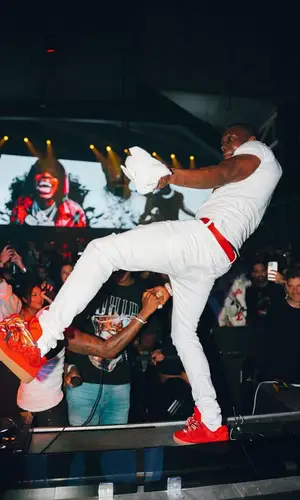 Bobby Shmurda wearing Prada belt