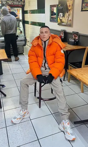 ArrDee wearing Axel Arigato sneakers