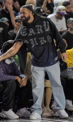 Drake wearing Drake Merch hoody