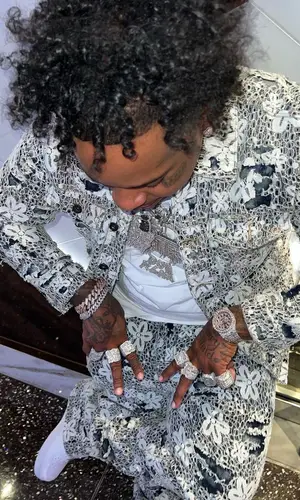 Finesse2tymes’ Outfit in Valabasas Jacket & Nike Sneakers (2023)