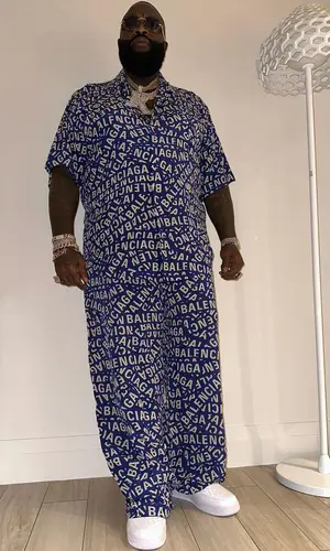 Rick Ross wearing Balenciaga shirt