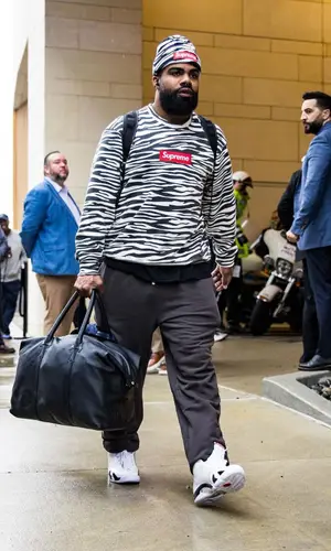 Ezekiel Elliott wearing Supreme sweatshirt