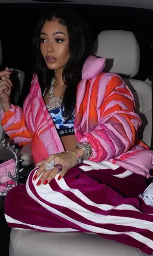 Coi Leray wearing Bape top