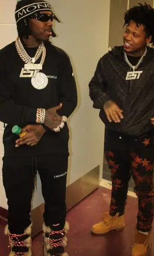 EST Gee wearing Moncler pants