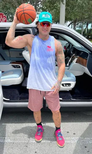 Riff Raff wearing Flood Sport cap