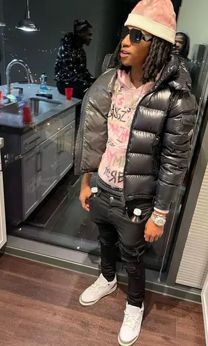 Lil Darius wearing Prada eyewear