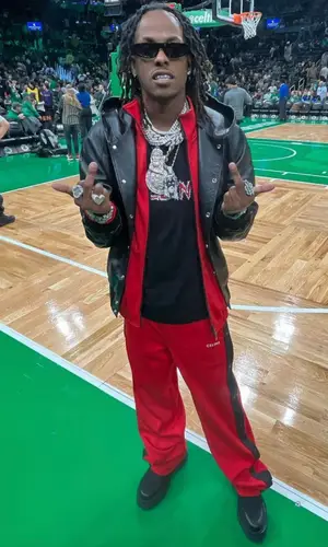 Rich The Kid wearing Celine boots