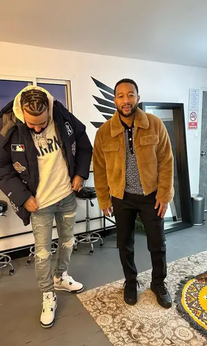 John Legend wearing Valentino sneakers