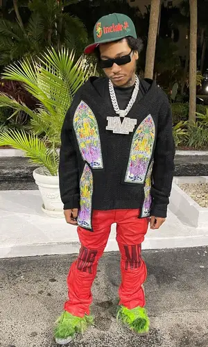 Lil Meech wearing New Era cap