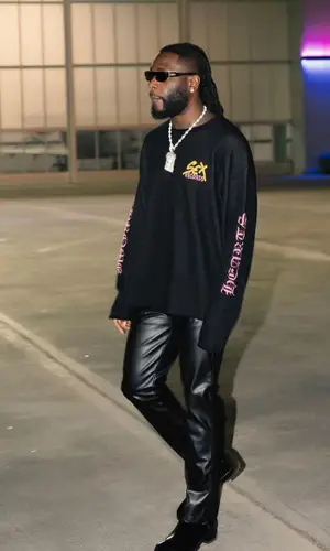 Burna Boy wearing Chrome Hearts sweater