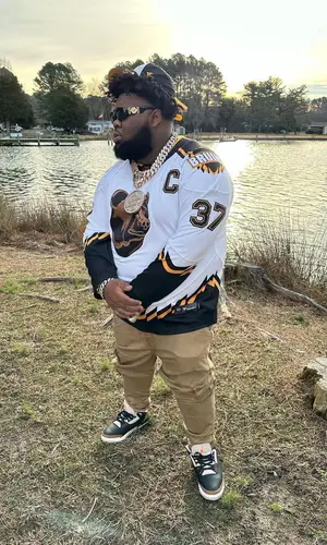 Rod Wave wearing Fanatics cap