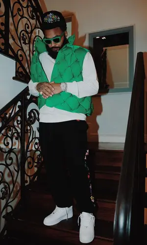 Clarence White wearing Nike sneakers