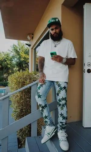 Clarence White wearing Amiri jeans