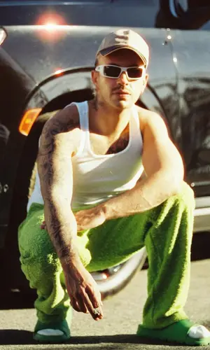 Feid wearing Eric Emanuel pants