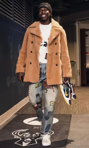 Jrue Holiday wearing Rhude jeans