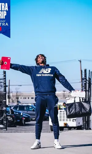 Tyrese Maxey’s Outfit in New Balance Hoodie & Louis Vuitton Bag (2023)