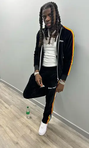 SleazyWorld Go wearing Palm Angels pants