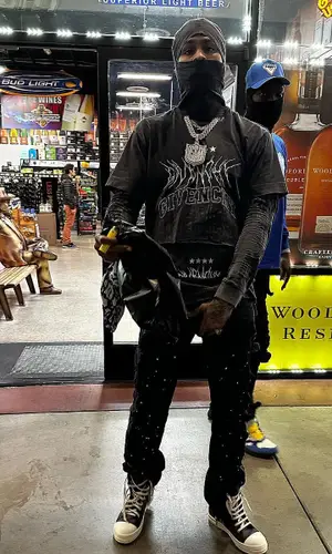 Dave East wearing Givenchy t-shirt