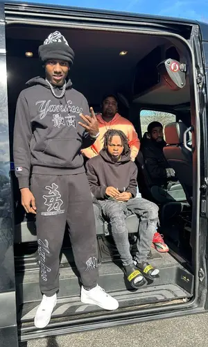 PGF Nuk’s Outfit in New York Yankees Hoodie, Cartier Watch & Supreme (2023)