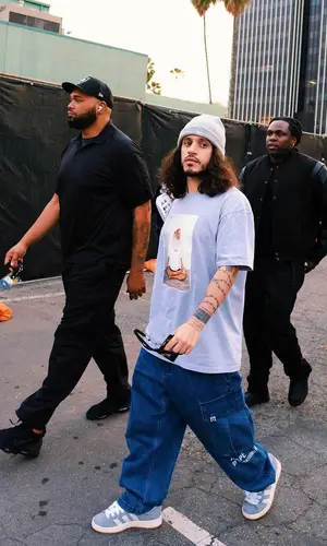 Russ’ Outfit in Supreme T-Shirt, Aape Pants & Kith Hat (2023)