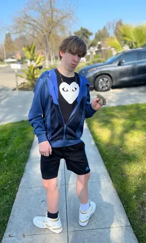 Lil Maceee wearing Adidas shorts