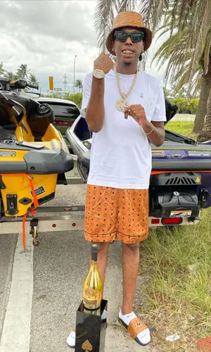 Goldenboy Countup wearing MCM hat