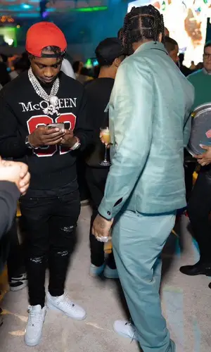 Lil Tjay wearing Amiri jeans