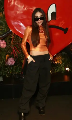 Danna Paola wearing Versace boots