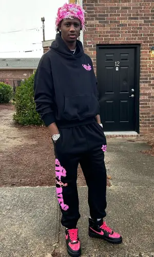 Yung Mal’s Outfit in Of1Ne Hoodie, Fnf Customs Sneakers & Lux Apparel Hat (2023)
