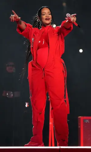 Rihanna’s Outfit in Alaïa Jacket, Loewe Suit & Maison Margiela Sneakers (2023)