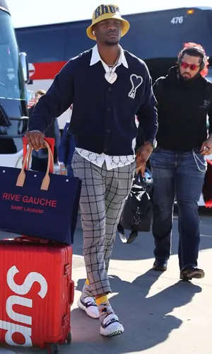 Marquez Valdes-Scantling wearing Saint Laurent bag