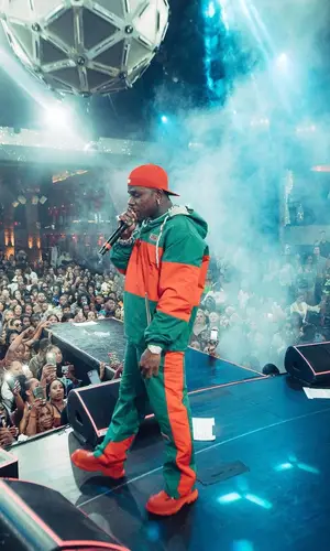 DaBaby wearing Alexander McQueen boots