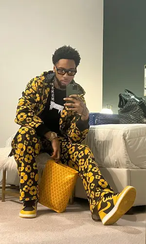 Key Glock wearing Goyard bag