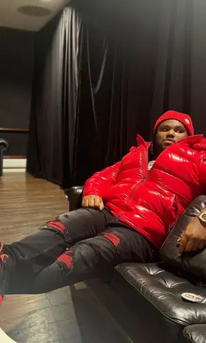 Tee Grizzley’s Outfit in Amiri Jeans, Jordan Sneakers & Moncler Hat (2023)