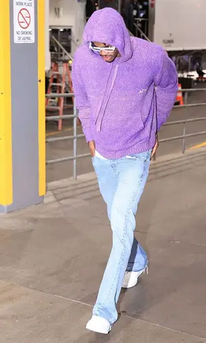 Jarred Vanderbilt’s Outfit in Amiri Hoodie, Gallery Dept. Jeans & Nike Sneakers (2023)