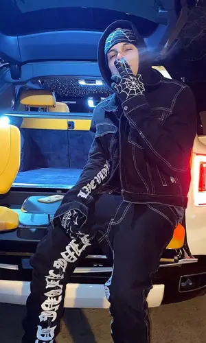 D Savage wearing Vlone jacket
