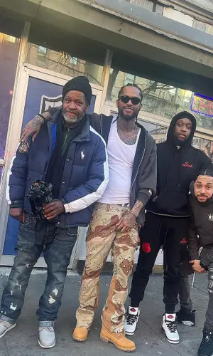 Dave East wearing Gallery Dept. pants