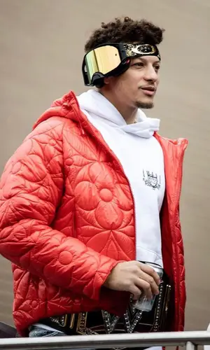 Patrick Mahomes II’s Outfit in Louis Vuitton Jacket, Amiri Jeans & Oakley Eyewear (2023)