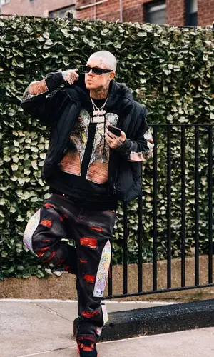 Millyz wearing Who Decides War jeans