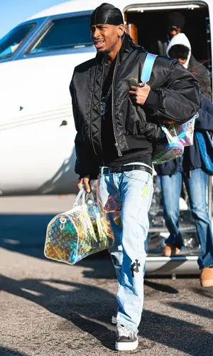 Shai wearing Louis Vuitton bag