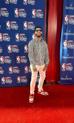 Anuel AA wearing Louis Vuitton shirt
