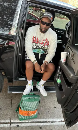 Peezy wearing Ceo Slow cap
