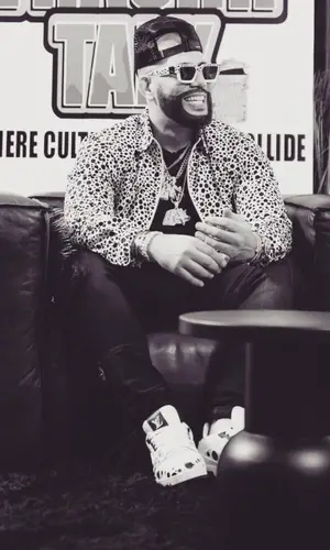 DJ Drama’s Outfit in Louis Vuitton Eyewear, Amiri Cap & Yayoi Kusama (2023)
