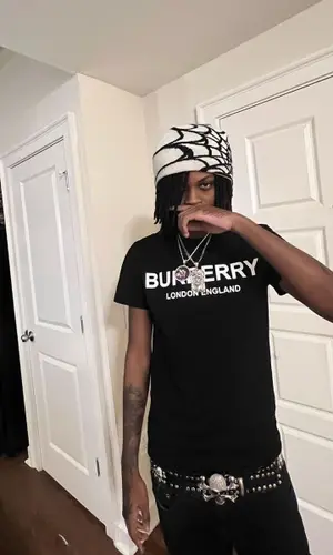 sgpwes wearing Act Up hat