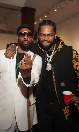 Dave East wearing Carhartt hat
