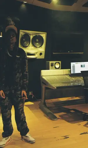 Lil Poppa wearing Chrome Hearts cap